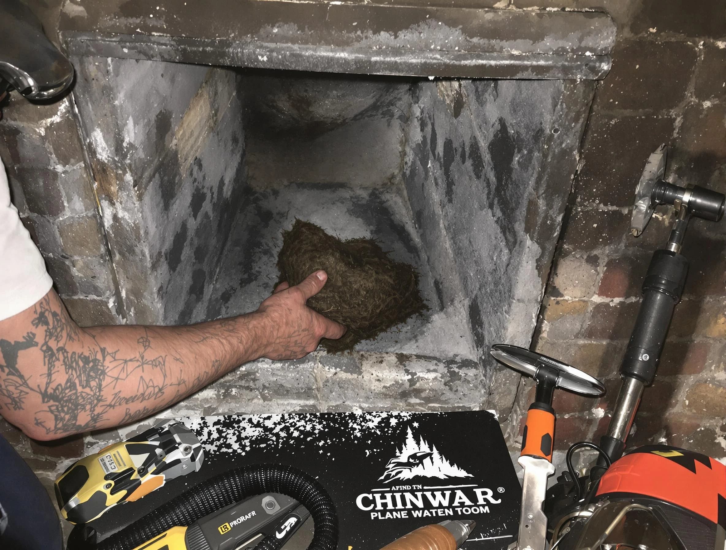 Colonial Heights Chimney Sweep safely removing debris and screening chimney in Colonial Heights, VA